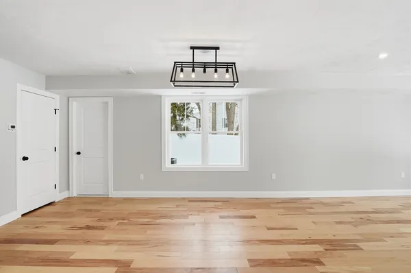 a view of a kitchen cabinets and wooden floor