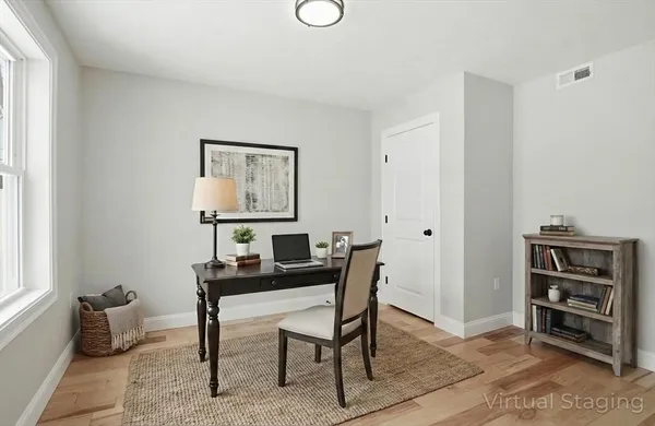 a workspace with furniture and window