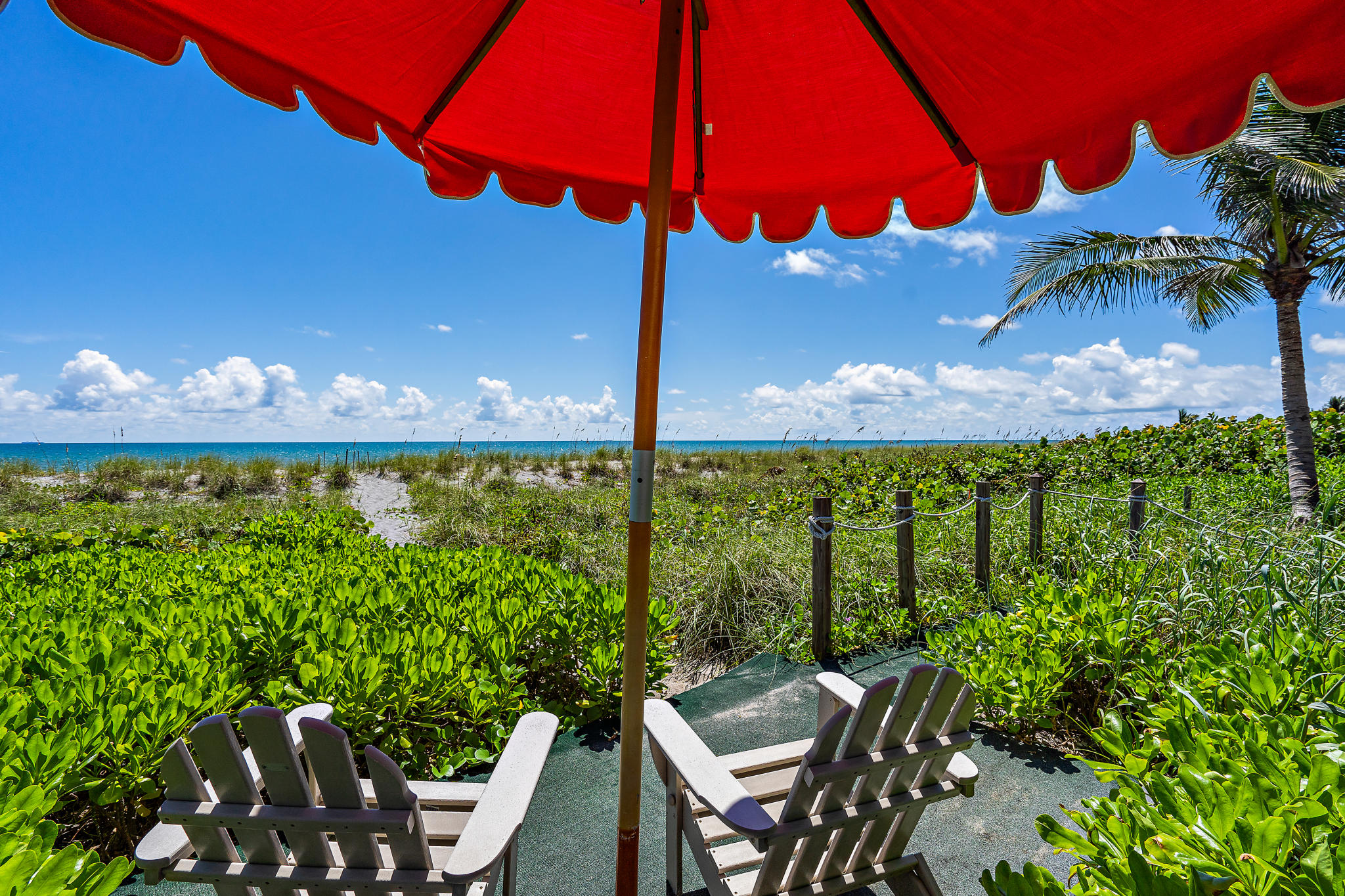 55 North Beach Road Hobe Sound, FL 33455 - Photo 33 of 64 umbrella with chairs