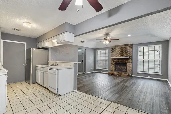 a kitchen with stove and cabinets
