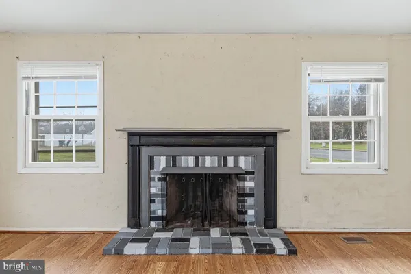 a view of fireplace and window