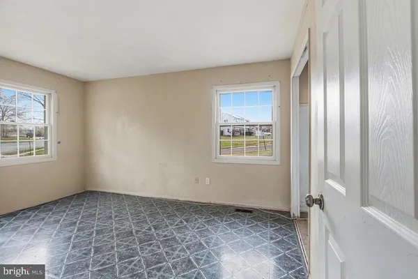 a view of an empty room and window