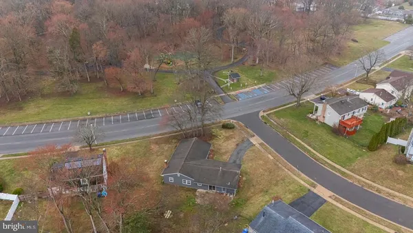 an aerial view of a house with a lake view