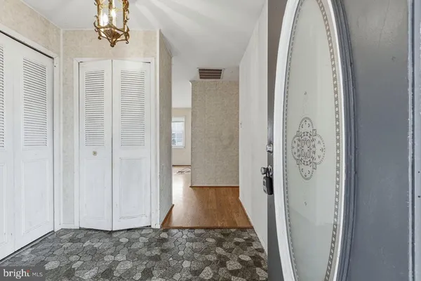 a view of entryway with wooden floor