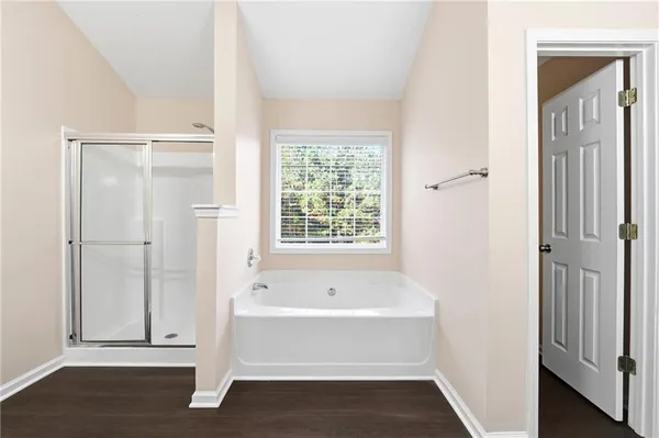 a bathroom with a bathtub and shower