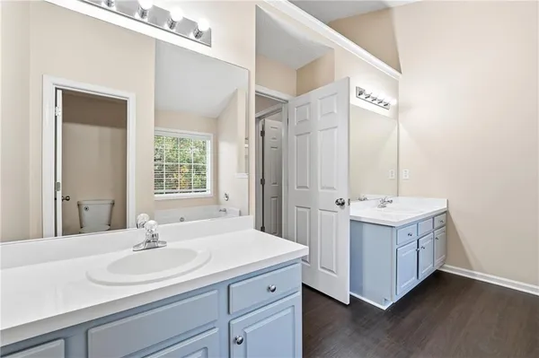 a bathroom with a sink double vanity and a mirror