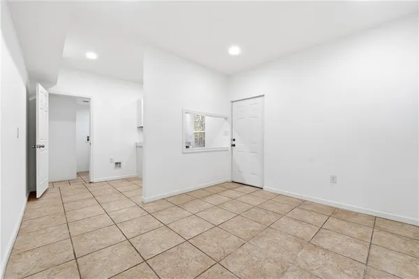 a room with a white cabinets and window