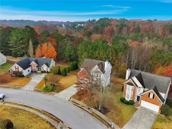 an aerial view of a house with outdoor space