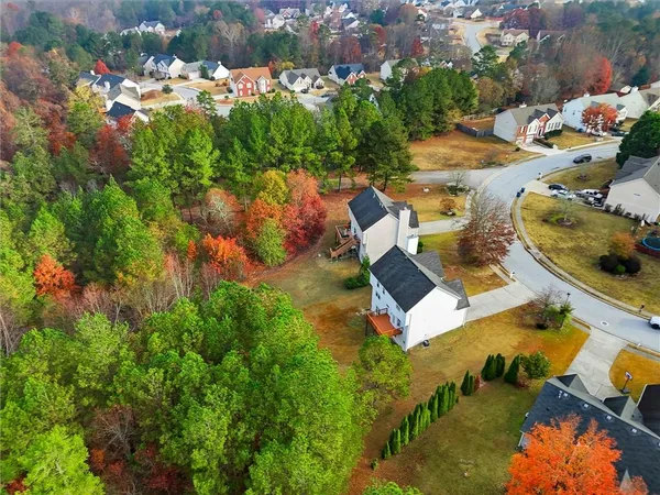 an aerial view of residential houses with outdoor space
