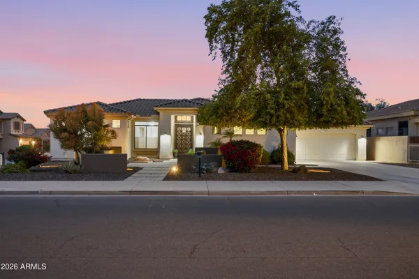 a view of a house with a cars park