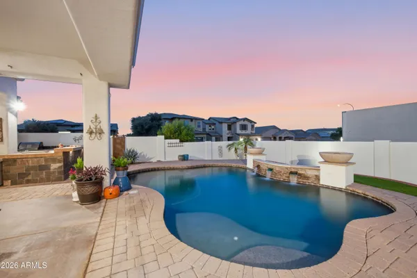 a view of a swimming pool with lounge chairs