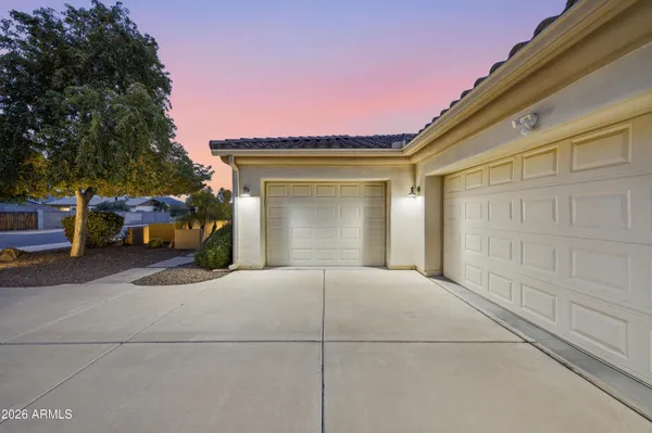 a front view of a house with garage