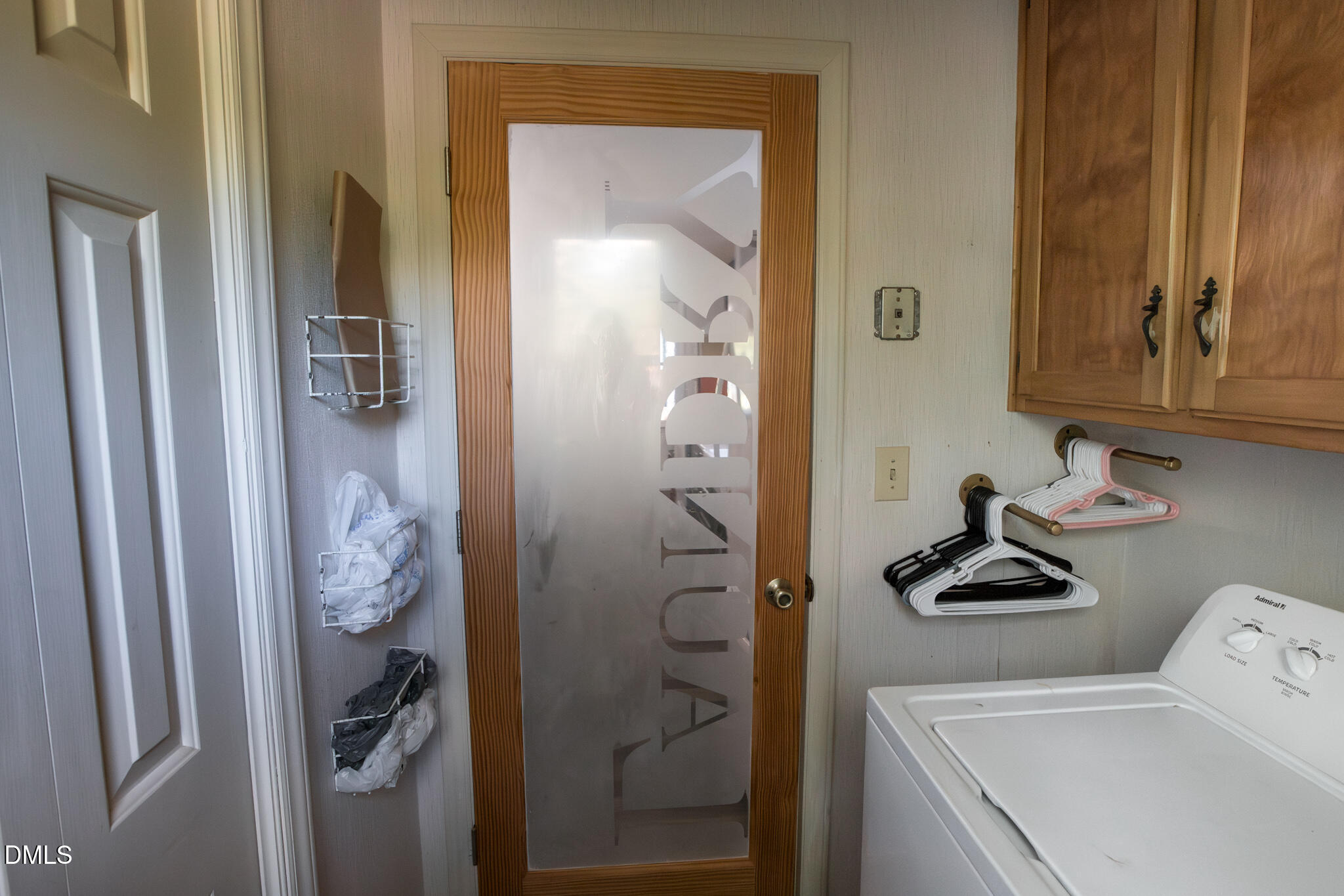 764 Corbett Road Clayton, NC 27520 - Photo 16 of 65 a bathroom with a sink and mirror