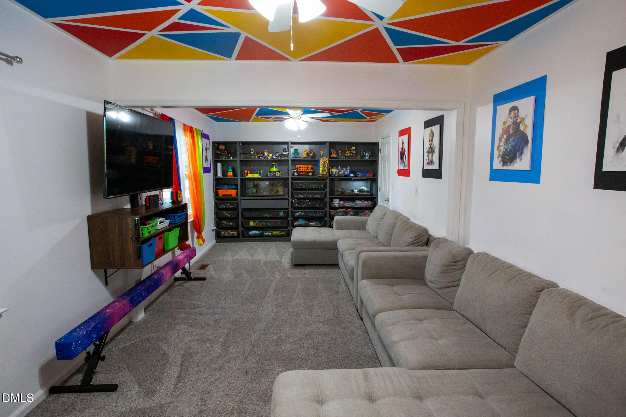 764 Corbett Road Clayton, NC 27520 - Photo 22 of 65 a living room with furniture and a flat screen tv