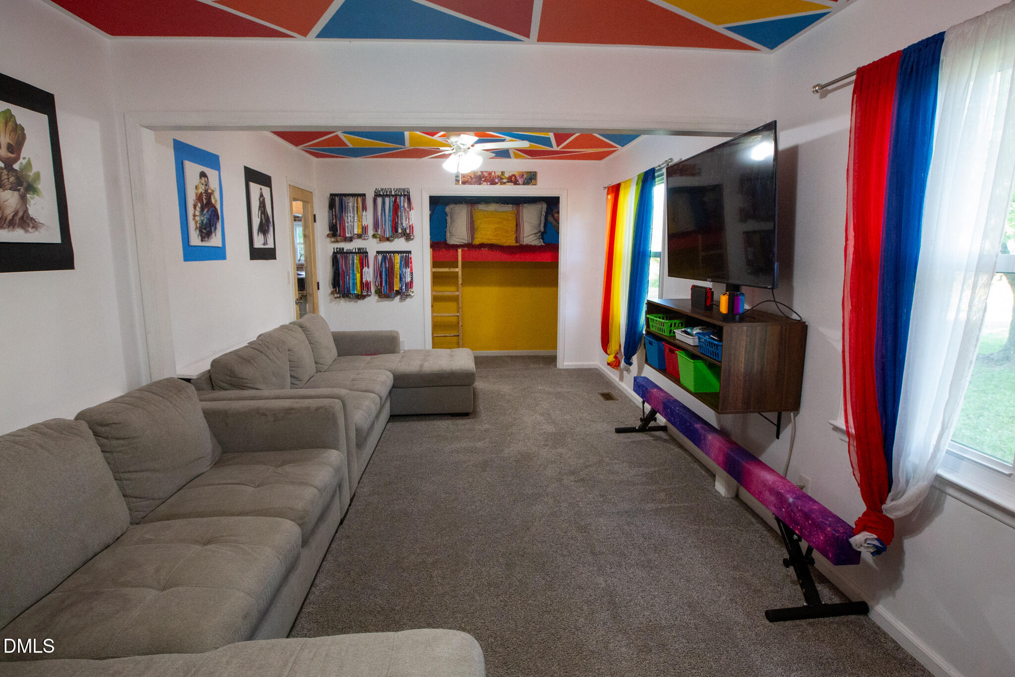 764 Corbett Road Clayton, NC 27520 - Photo 24 of 65 a living room with furniture and a flat screen tv