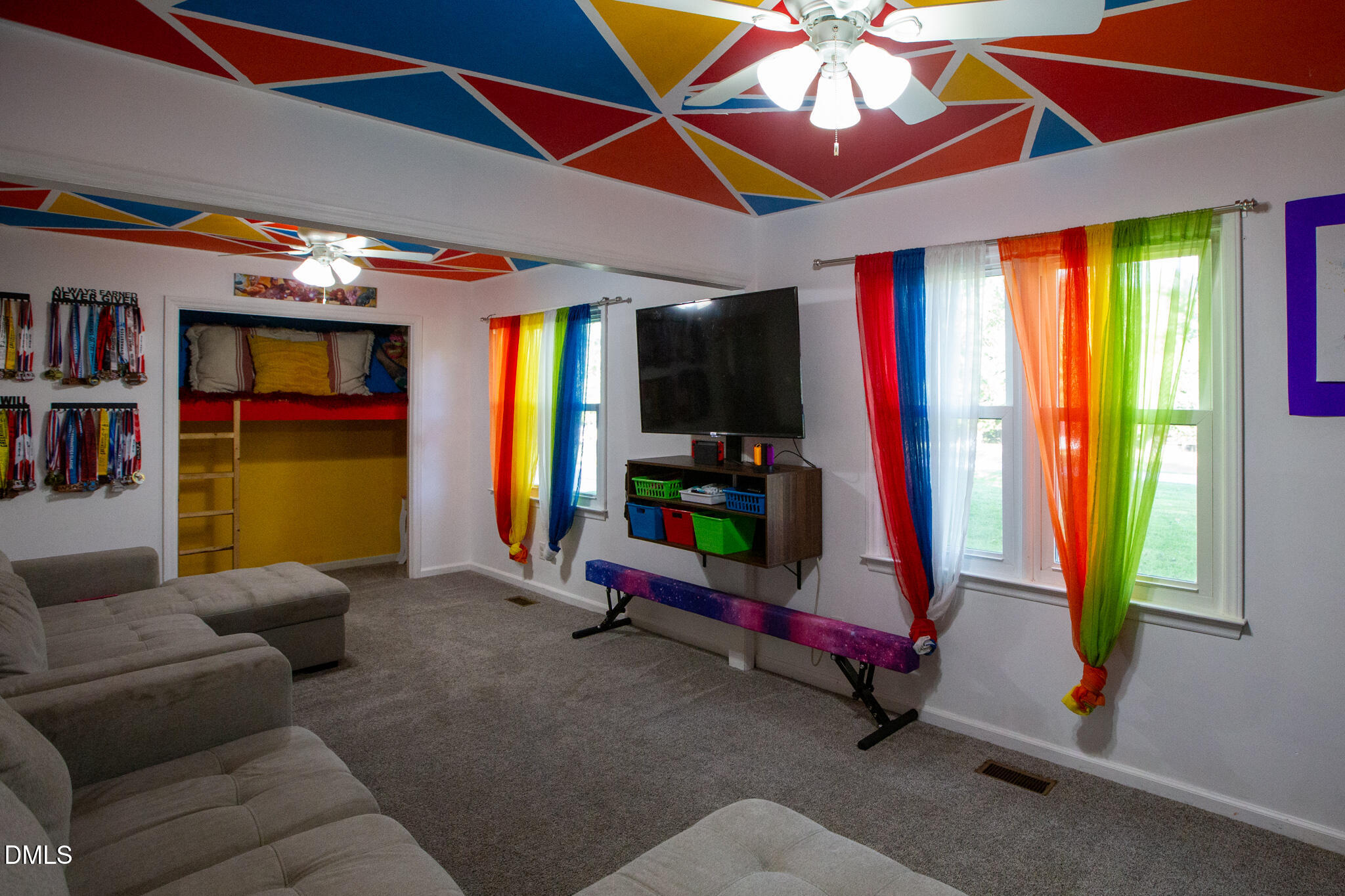 764 Corbett Road Clayton, NC 27520 - Photo 25 of 65 a living room with furniture and a flat screen tv