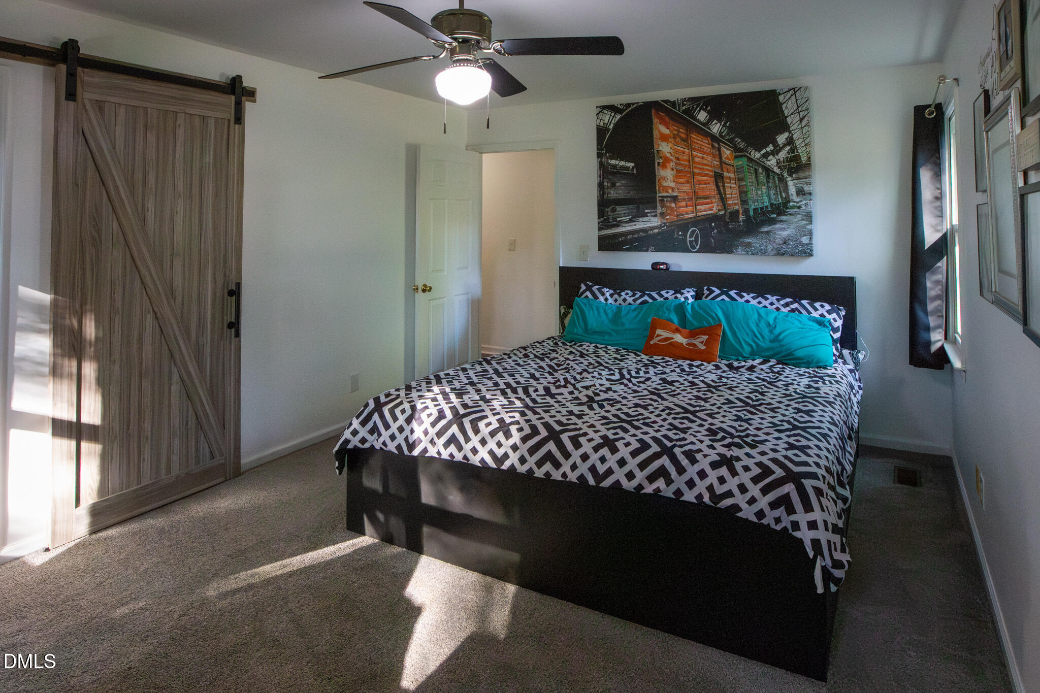 764 Corbett Road Clayton, NC 27520 - Photo 27 of 65 a bed sitting in a bedroom next to a window