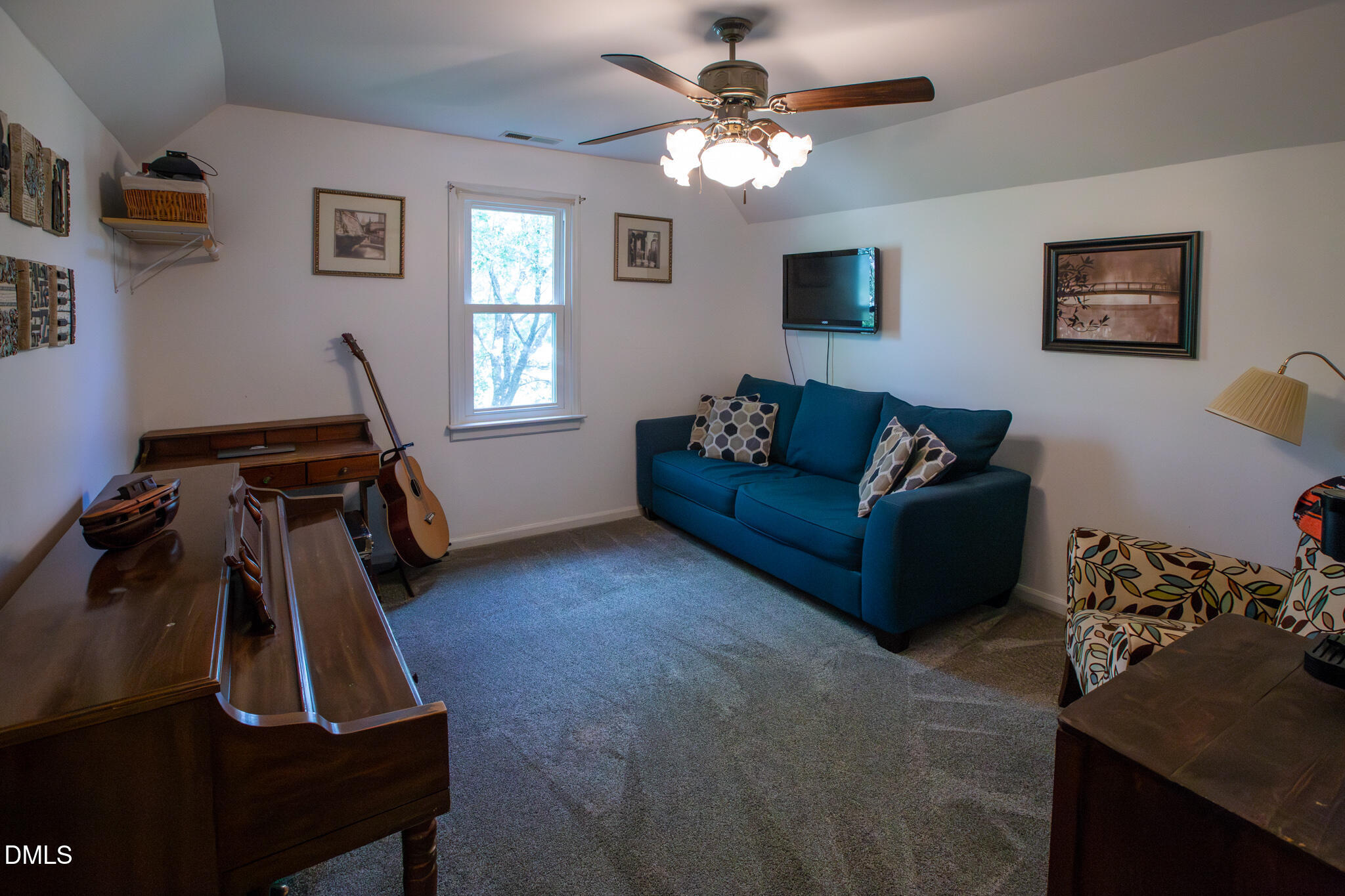 764 Corbett Road Clayton, NC 27520 - Photo 41 of 65 a living room with furniture and a flat screen tv
