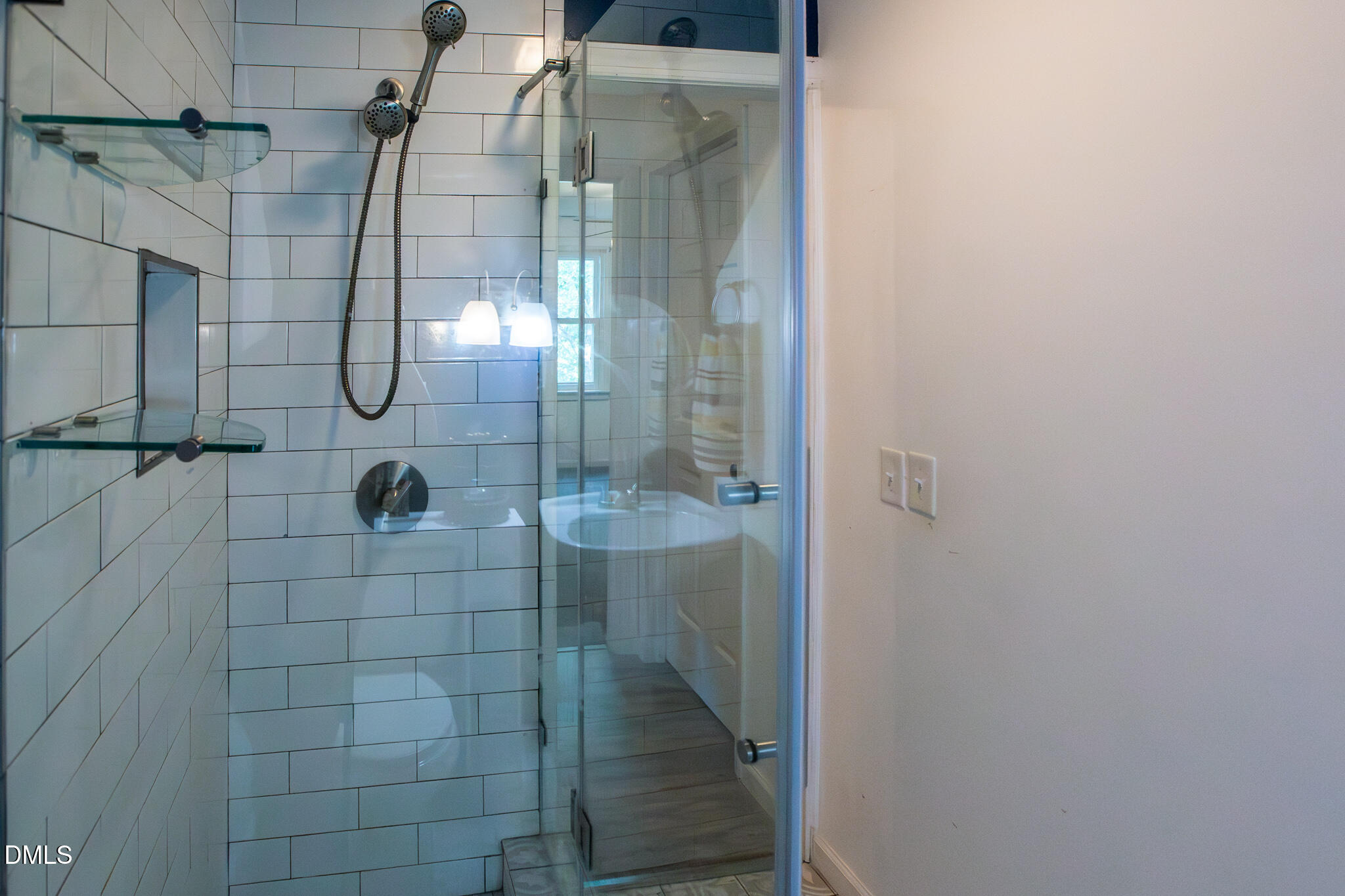 764 Corbett Road Clayton, NC 27520 - Photo 44 of 65 a bathroom with a glass shower door