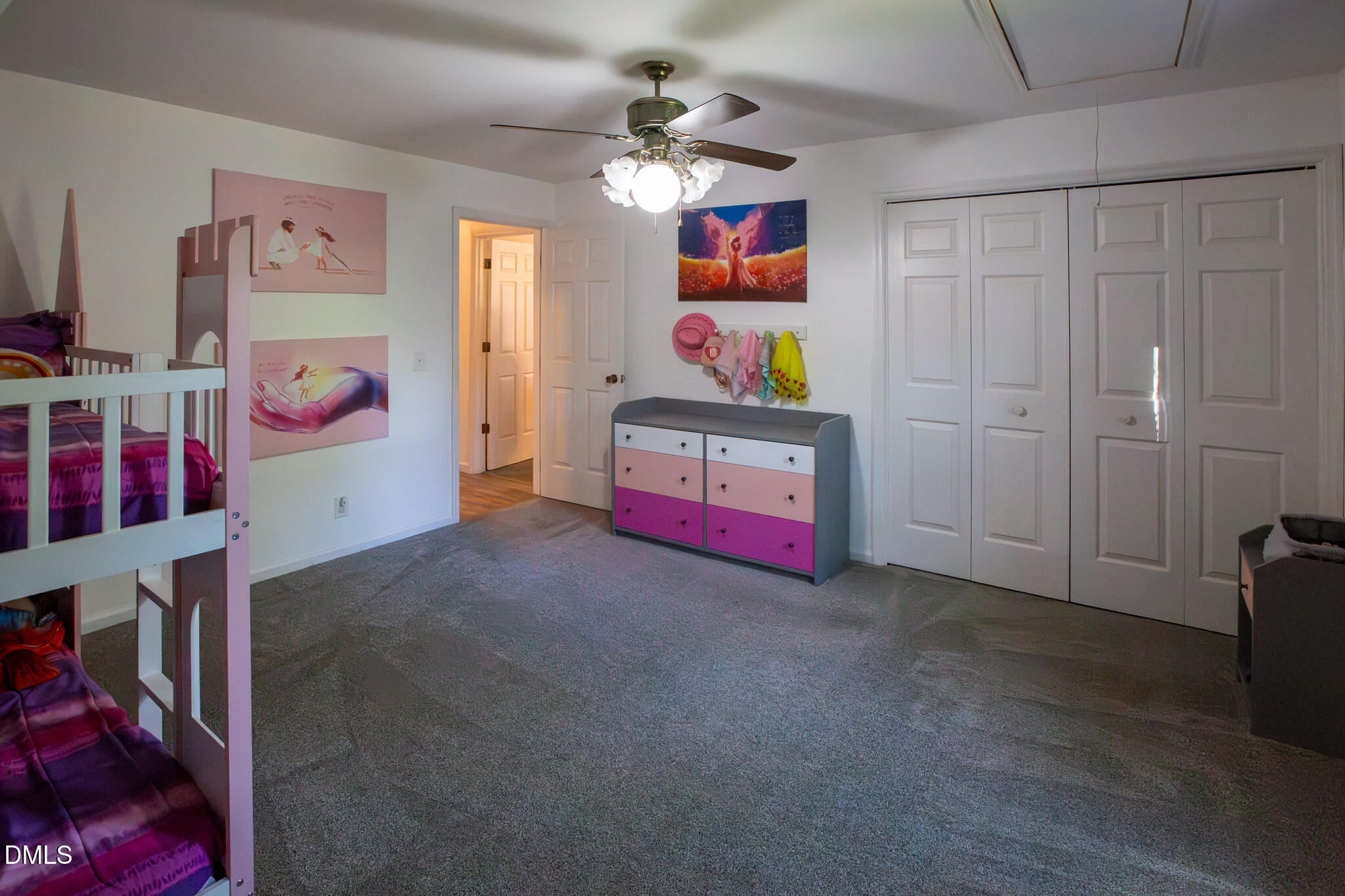 764 Corbett Road Clayton, NC 27520 - Photo 47 of 65 a living room with furniture and a chandelier
