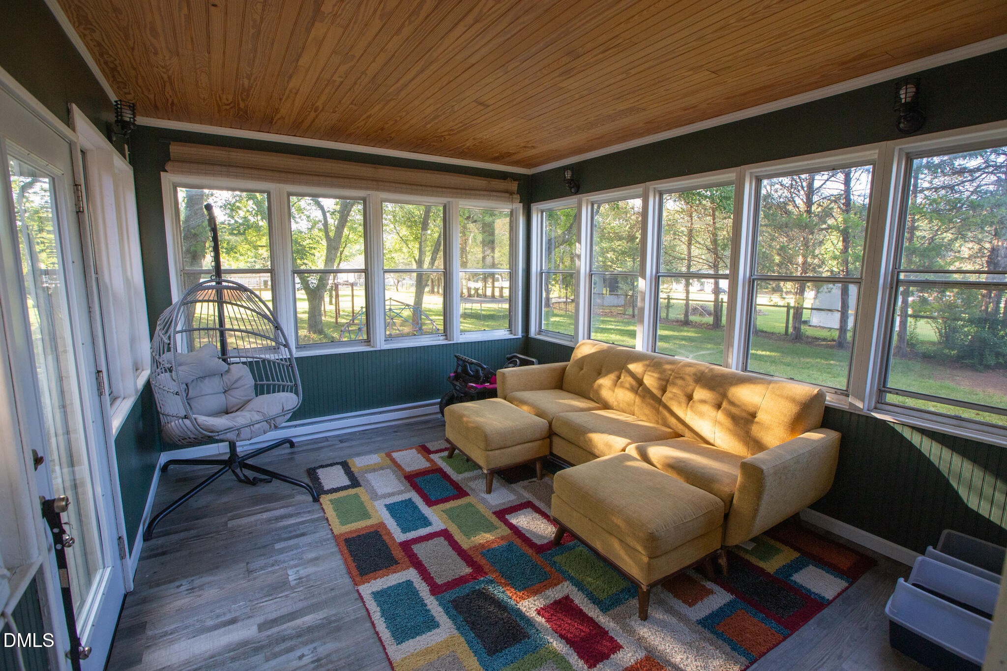 764 Corbett Road Clayton, NC 27520 - Photo 49 of 65 a bedroom with furniture and a large window