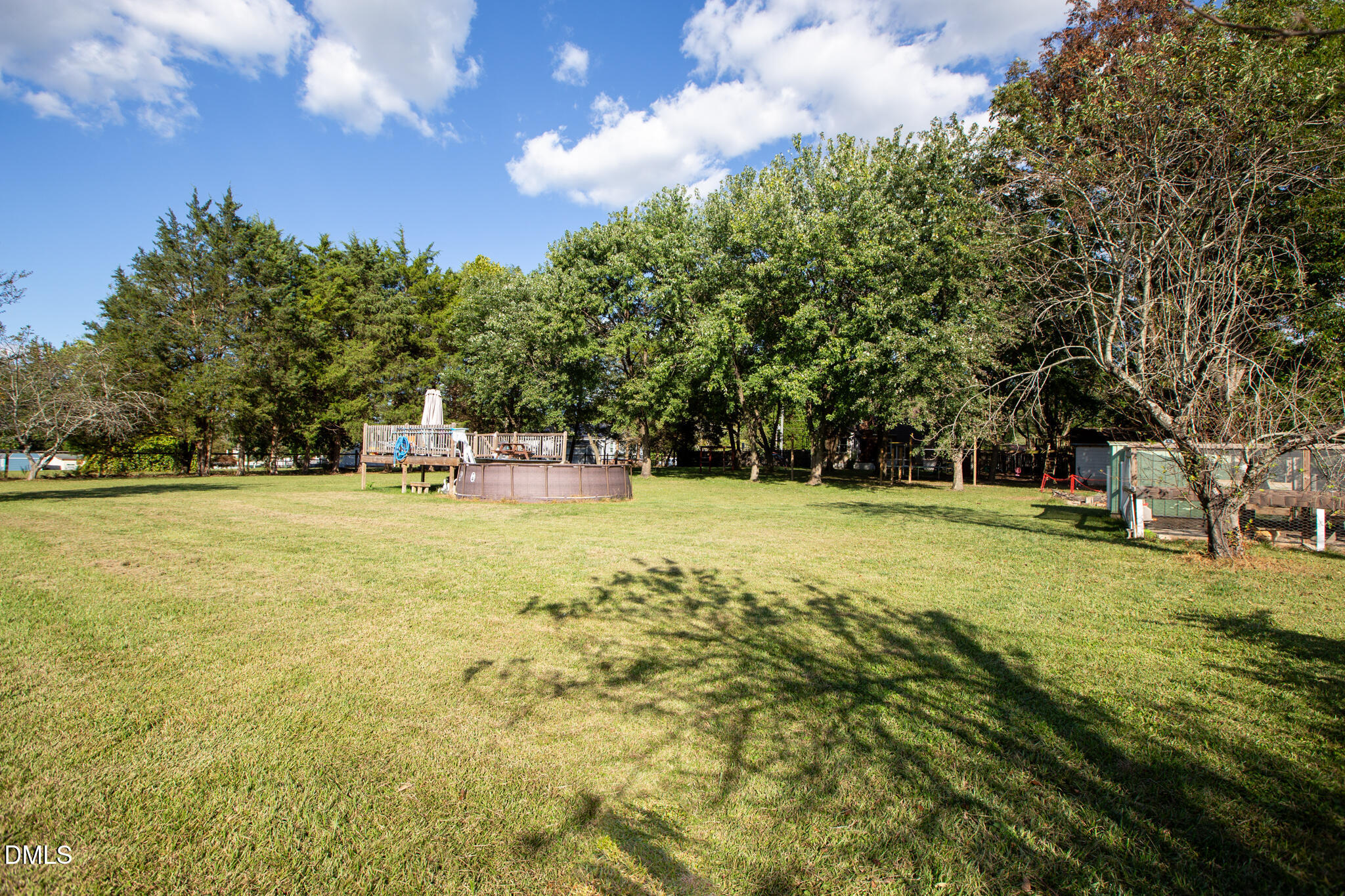 764 Corbett Road Clayton, NC 27520 - Photo 55 of 65 a view of yard with swimming pool and green space