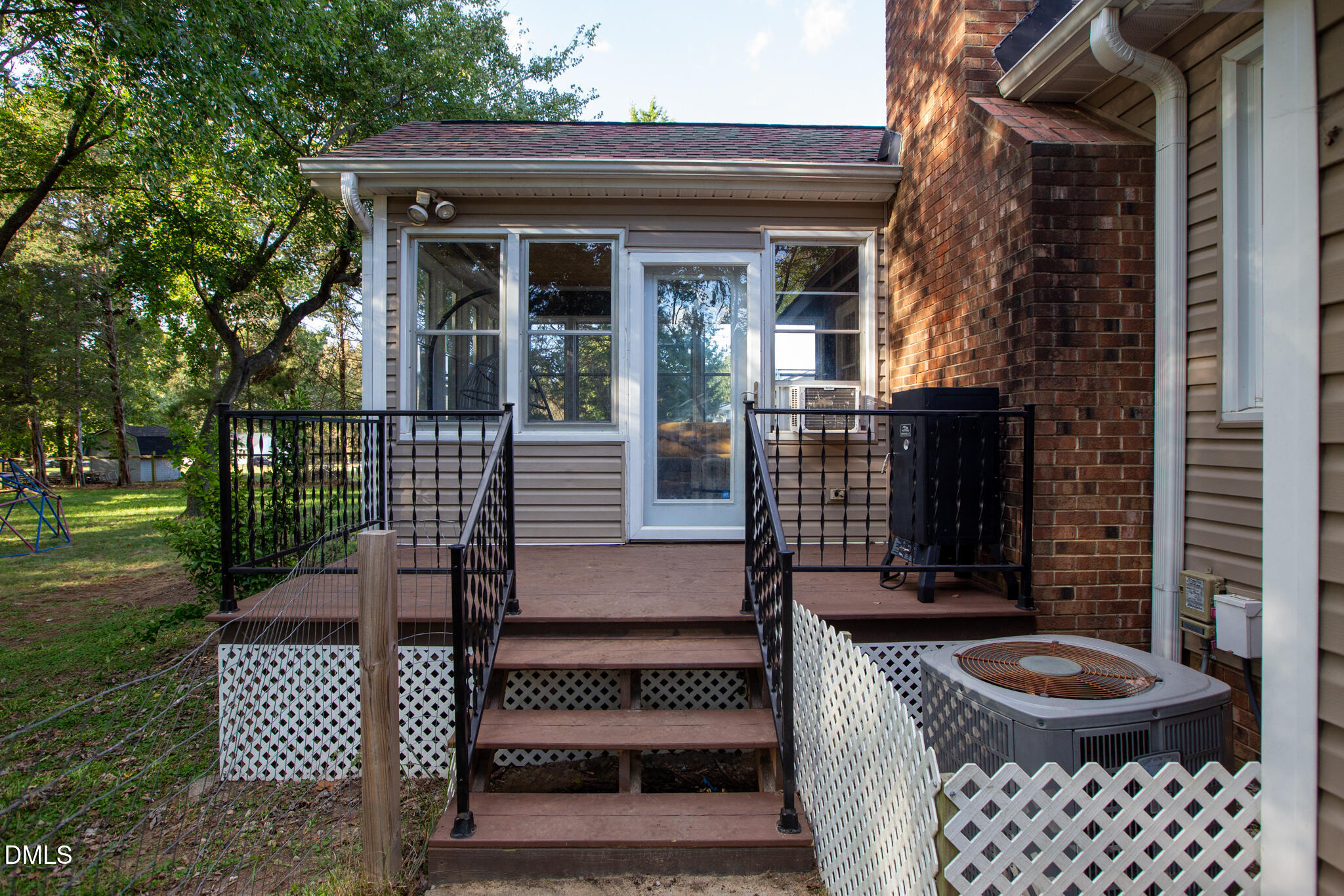 764 Corbett Road Clayton, NC 27520 - Photo 65 of 65 a view of front door of house with outdoor seating