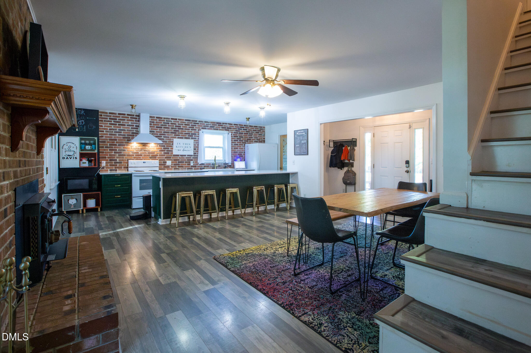 764 Corbett Road Clayton, NC 27520 - Photo 10 of 65 a view of a dining room with furniture a chandelier and wooden floor