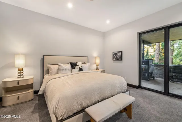 a bedroom with a bed and a night stand