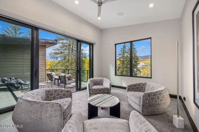 a view of a chairs and table in the balcony
