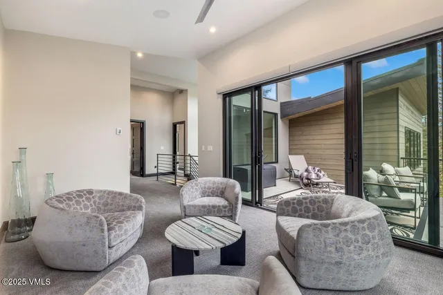 a view of a chairs and table in the balcony