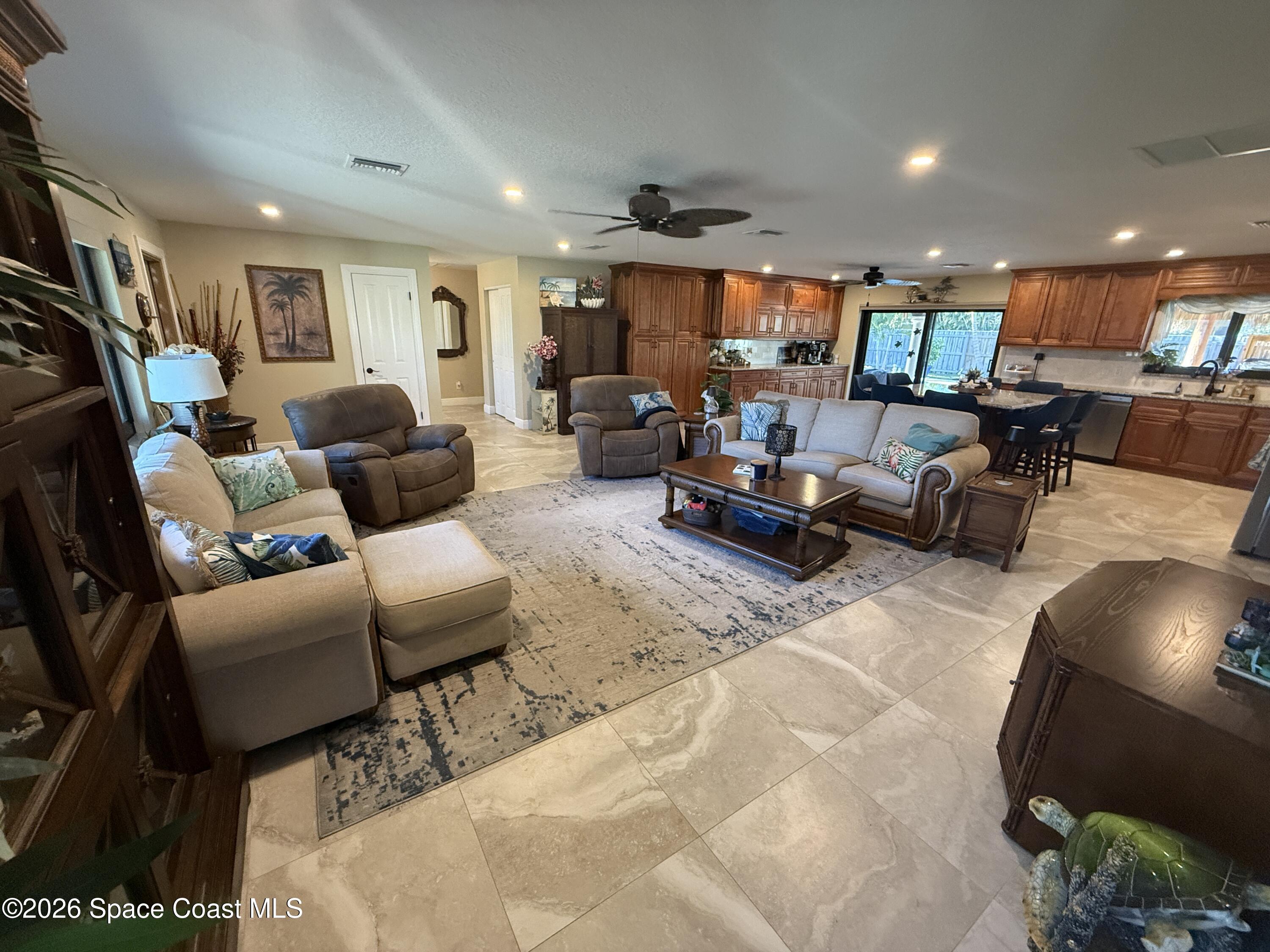 1908 Cedar Lane Melbourne Beach, FL 32951 - Photo 31 of 52 a living room with furniture and a wooden floor