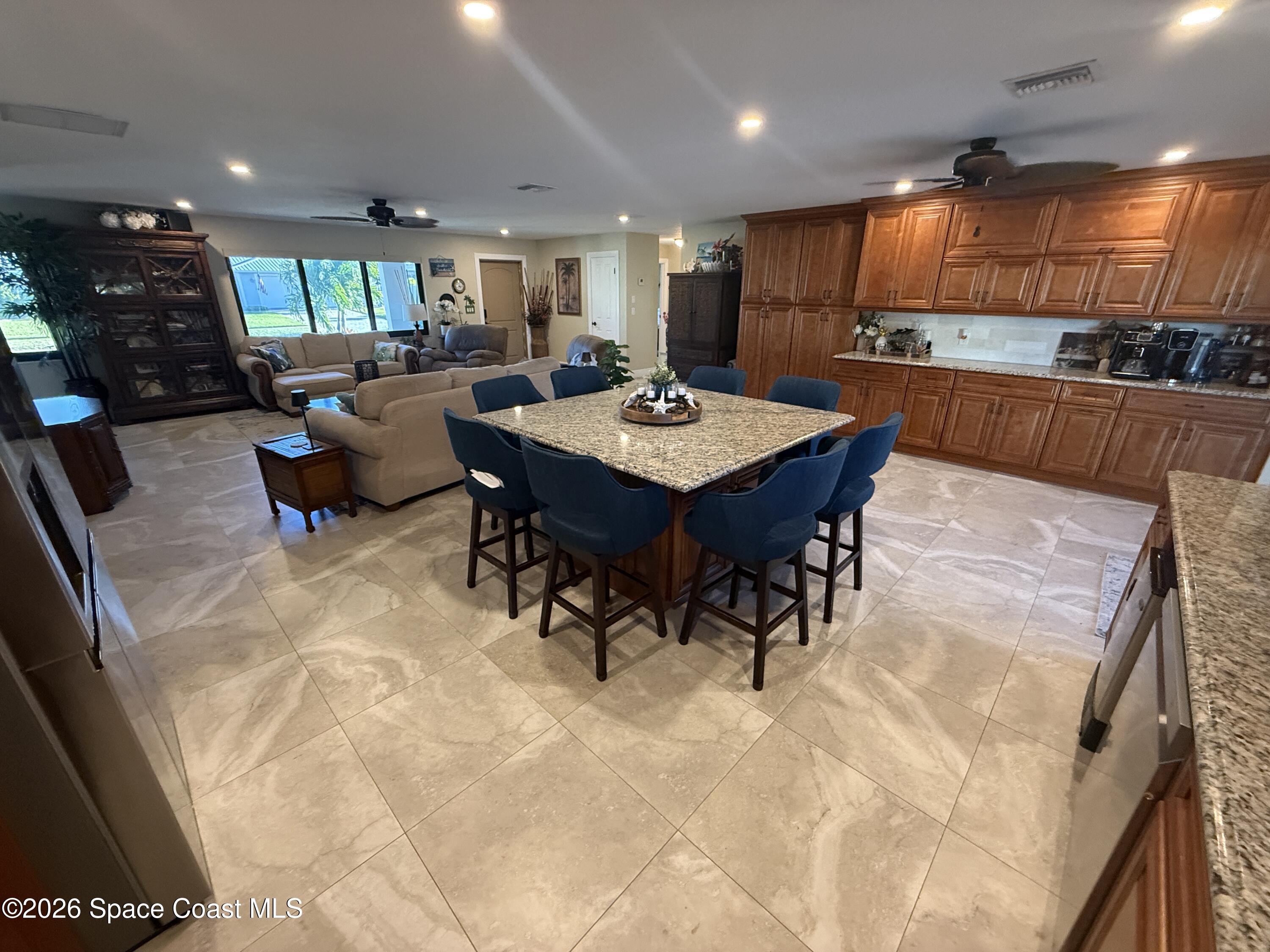 1908 Cedar Lane Melbourne Beach, FL 32951 - Photo 32 of 52 a large kitchen with a table and chairs