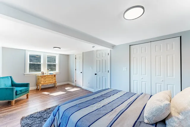 a bedroom with bed and window