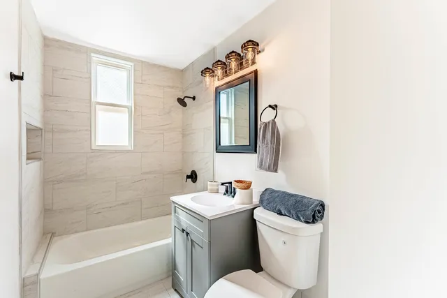 a bathroom with a sink a toilet and a bathtub