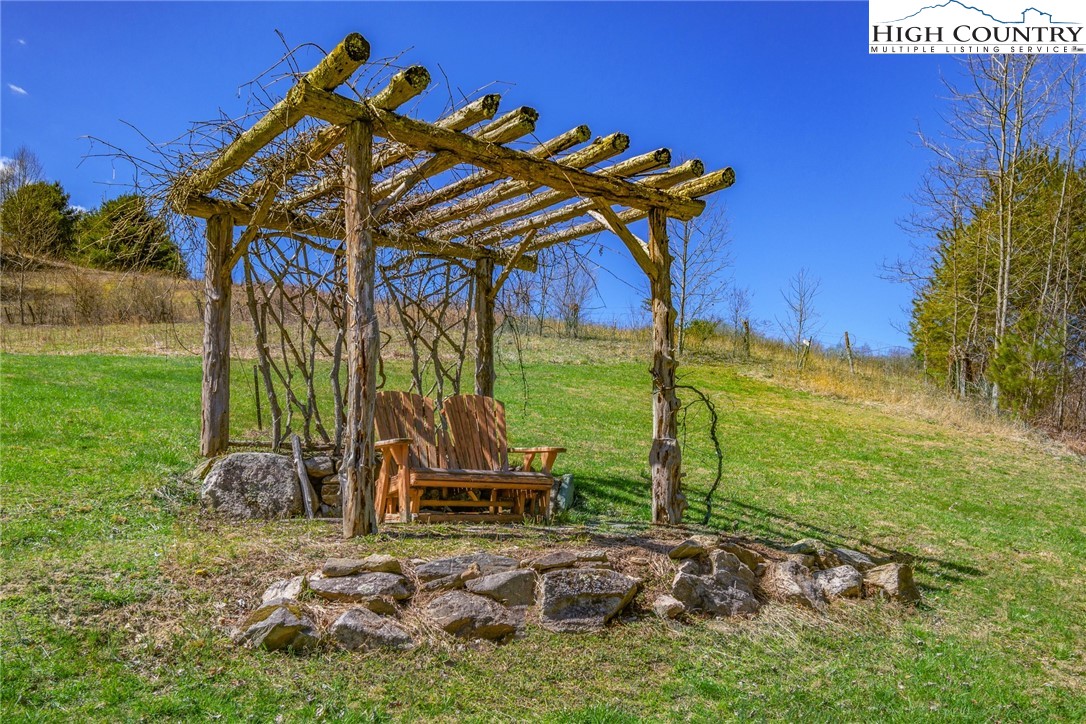 2709 Buckeye Road Elk Park, NC 28622 - Photo 40 of 43 a view of a yard with table and chairs