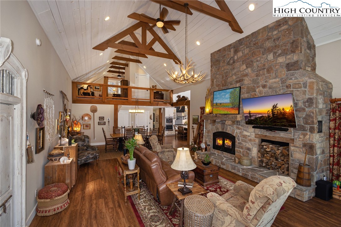 2709 Buckeye Road Elk Park, NC 28622 - Photo 7 of 43 a living room with fireplace furniture and a fireplace