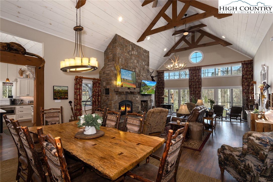 2709 Buckeye Road Elk Park, NC 28622 - Photo 8 of 43 a view of a dining area with furniture window and wooden floor