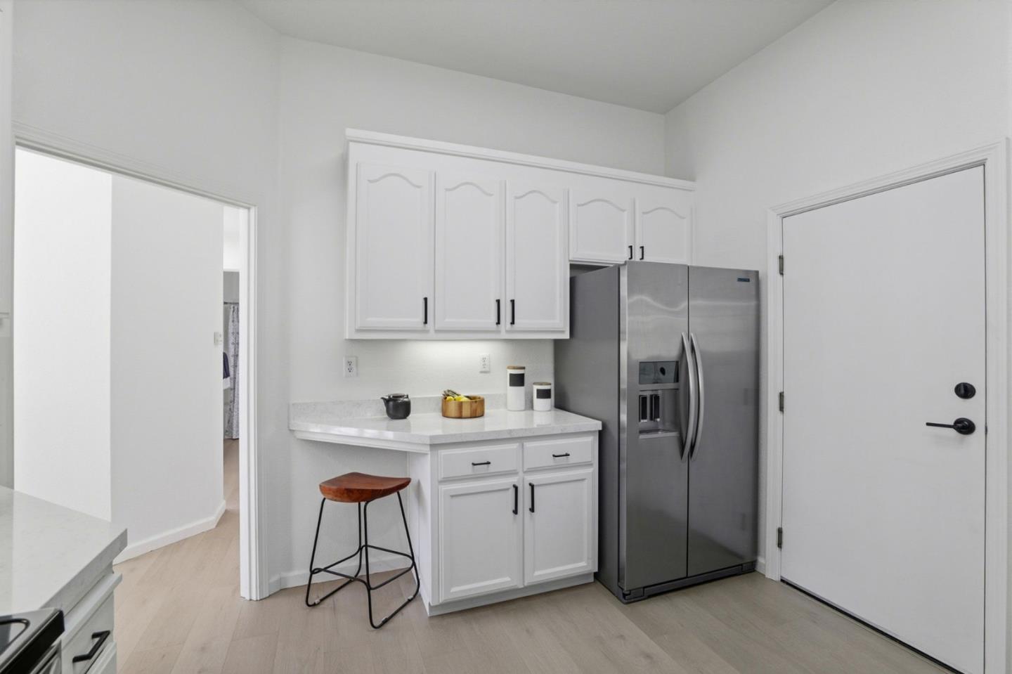 8611 Vineyard Ridge Place San Jose, CA 95135 - Photo 13 of 49 a kitchen with a refrigerator a sink and cabinets