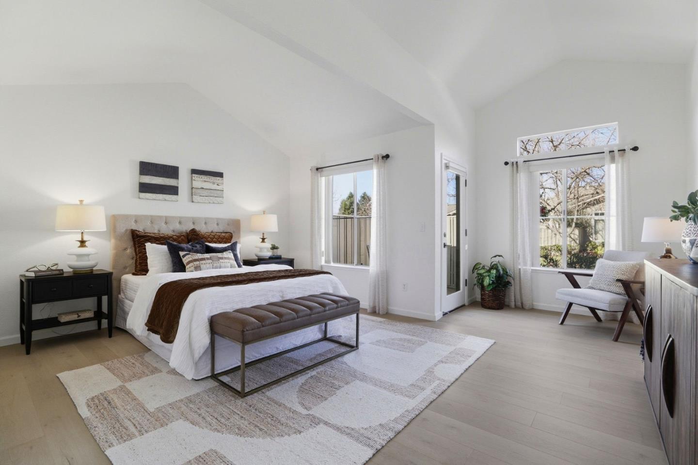 8611 Vineyard Ridge Place San Jose, CA 95135 - Photo 14 of 49 a spacious bedroom with a bed and a couch