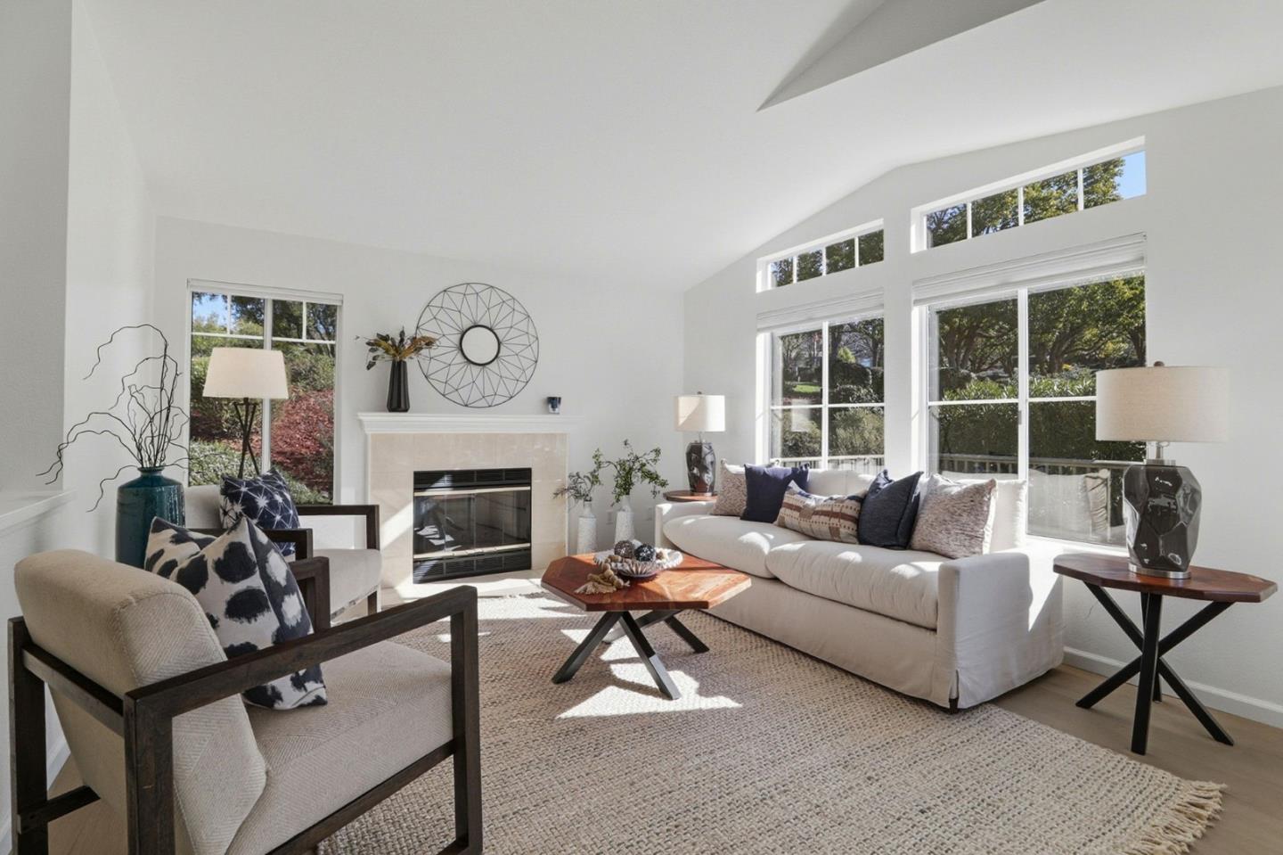 8611 Vineyard Ridge Place San Jose, CA 95135 - Photo 15 of 49 a living room with furniture a fireplace and a large window