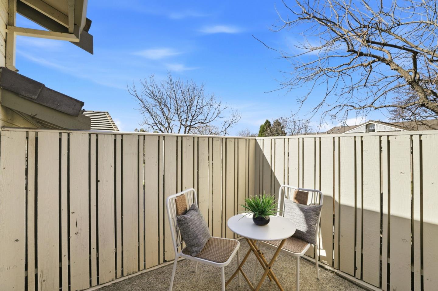 8611 Vineyard Ridge Place San Jose, CA 95135 - Photo 19 of 49 a view of a chairs and table in backyard