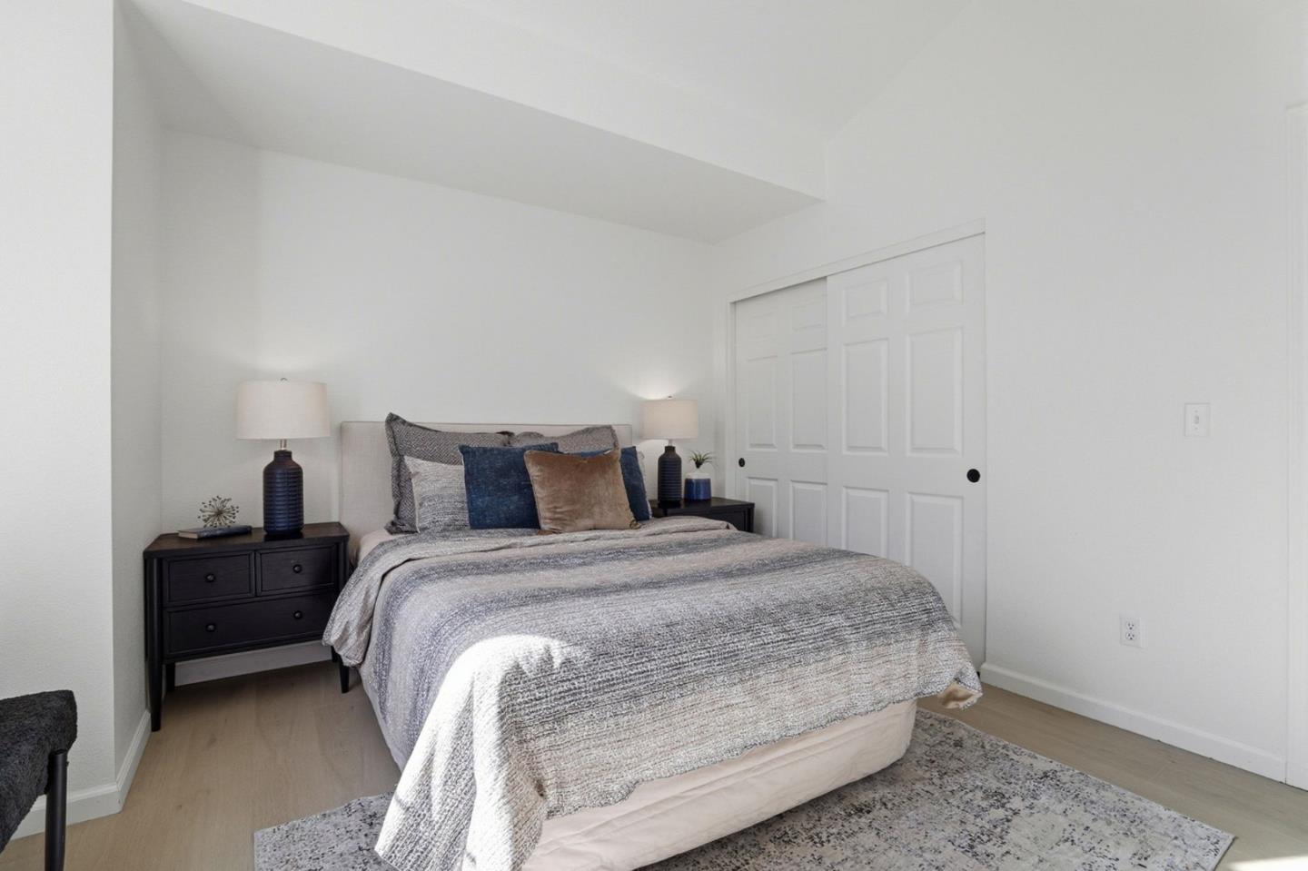 8611 Vineyard Ridge Place San Jose, CA 95135 - Photo 21 of 49 a bedroom with a bed and a chair