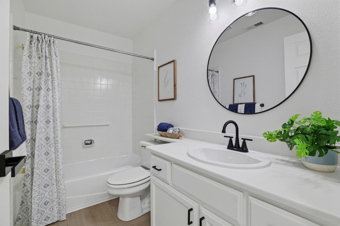 8611 Vineyard Ridge Place San Jose, CA 95135 - Photo 22 of 49 a bathroom with a sink a toilet and a mirror