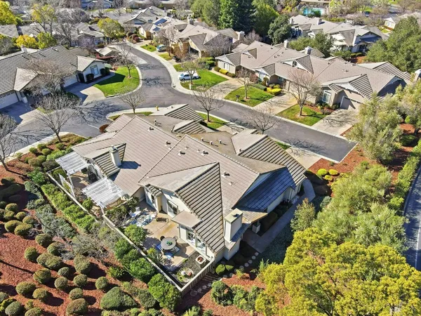an aerial view of a house with a garden