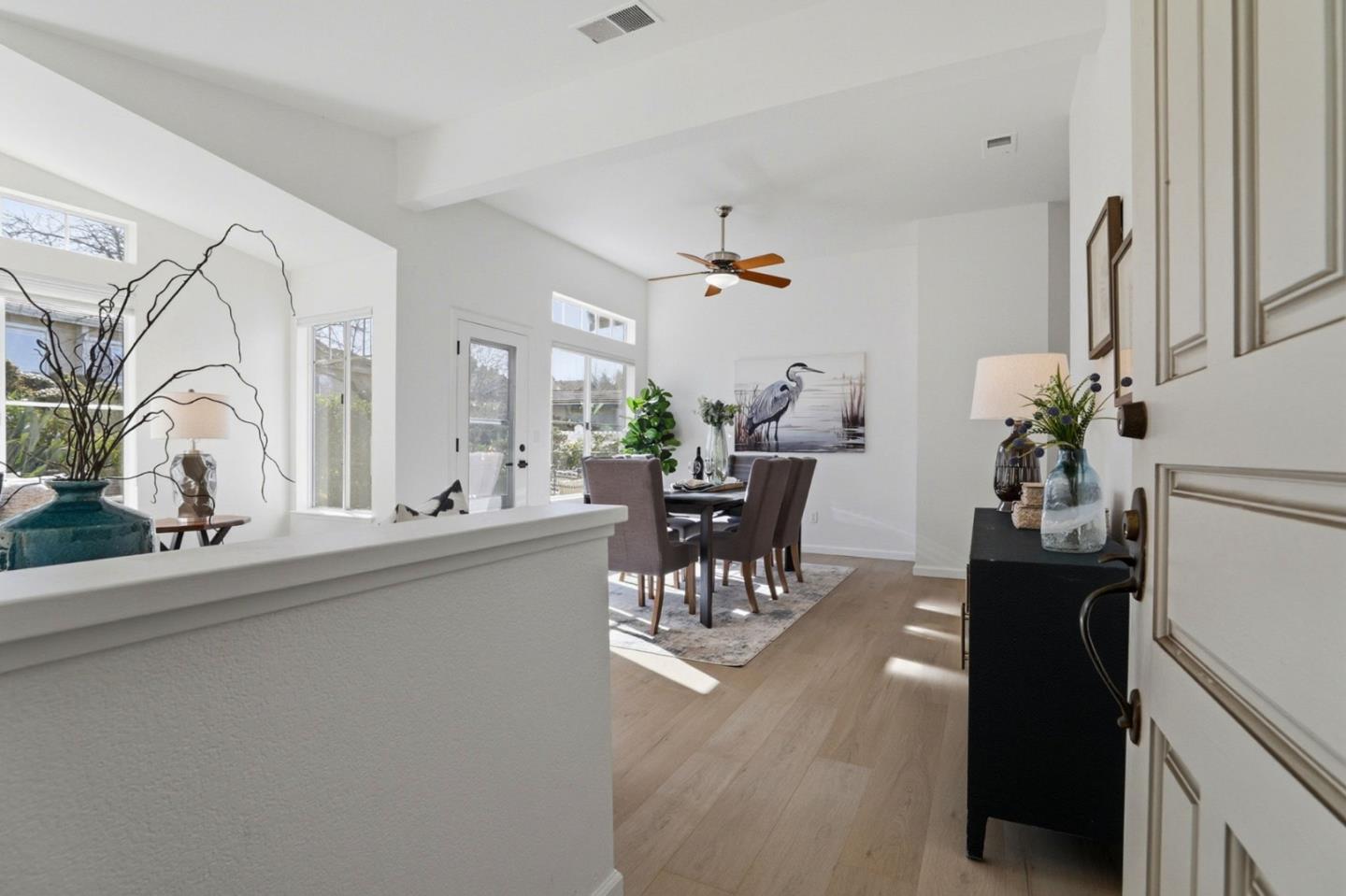8611 Vineyard Ridge Place San Jose, CA 95135 - Photo 3 of 49 a living room with furniture and a chandelier