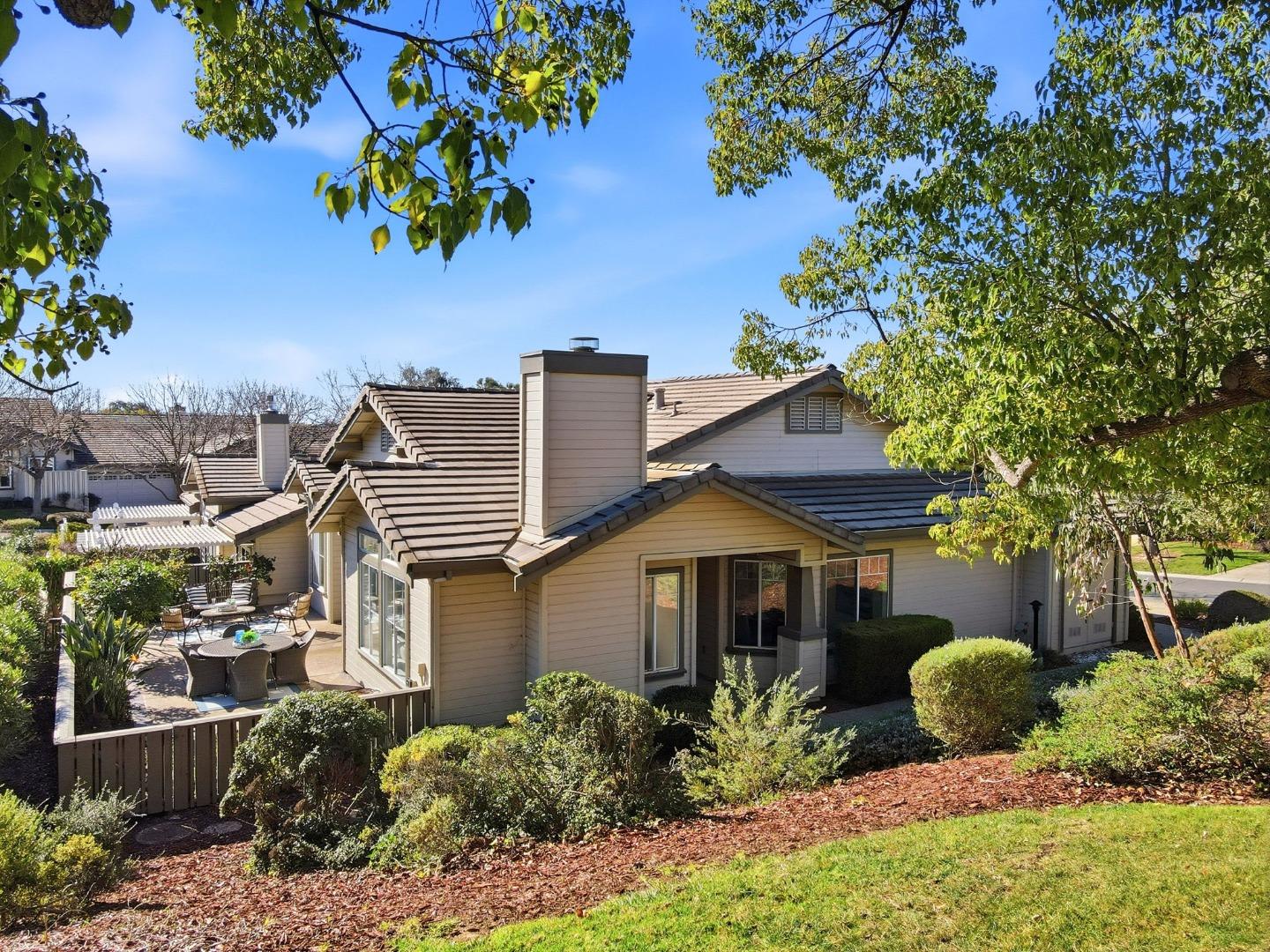 8611 Vineyard Ridge Place San Jose, CA 95135 - Photo 33 of 49 a front view of a house with a yard and potted plants