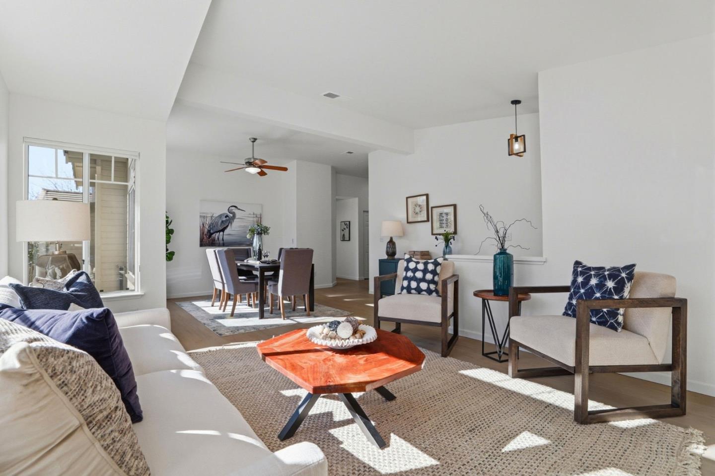 8611 Vineyard Ridge Place San Jose, CA 95135 - Photo 4 of 49 a living room with furniture a table and chairs