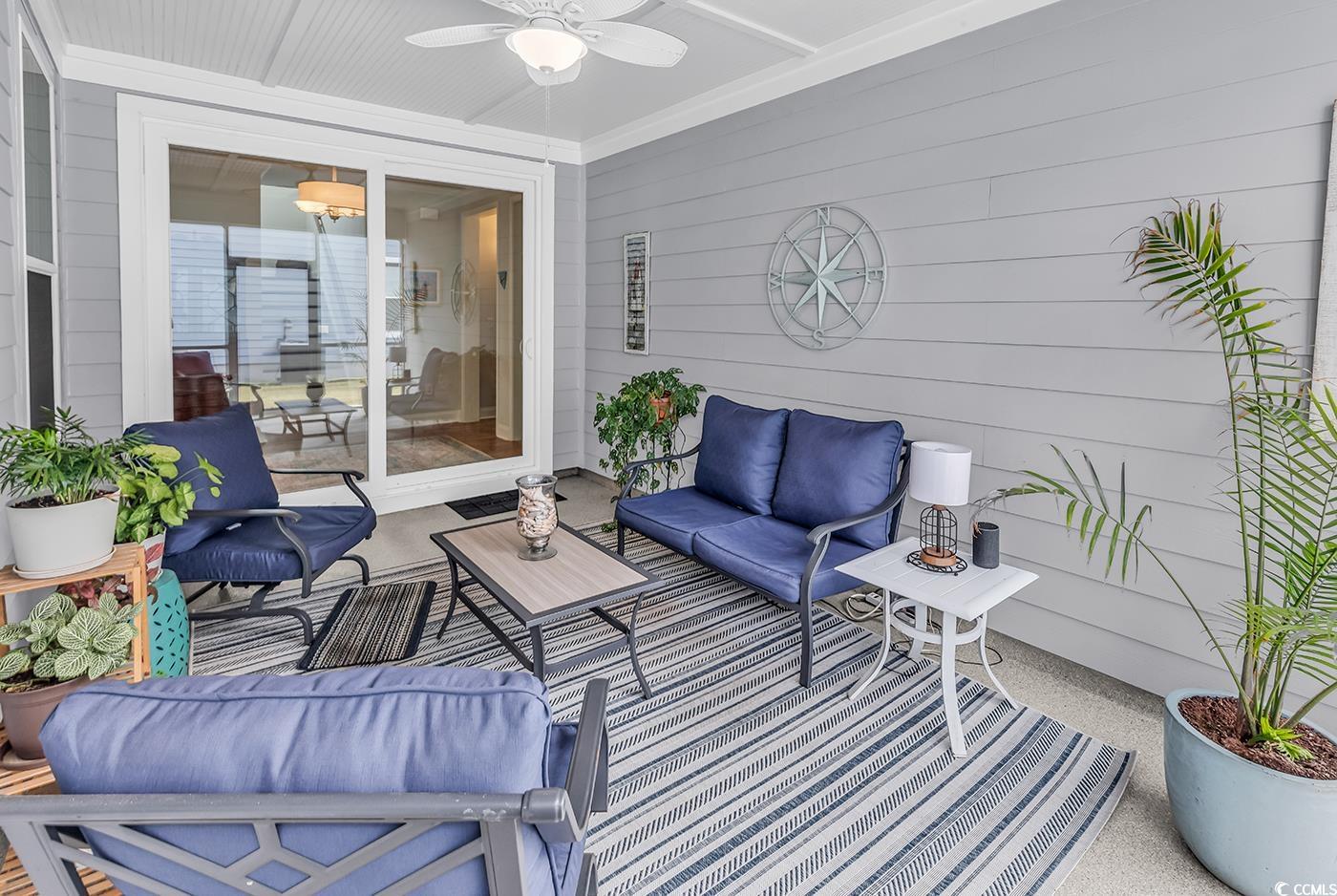 6024 Curran Street Murrells Inlet, SC 29576 - Photo 11 of 34 Sunroom / solarium featuring an outdoor living space, a patio area, and a ceiling fan