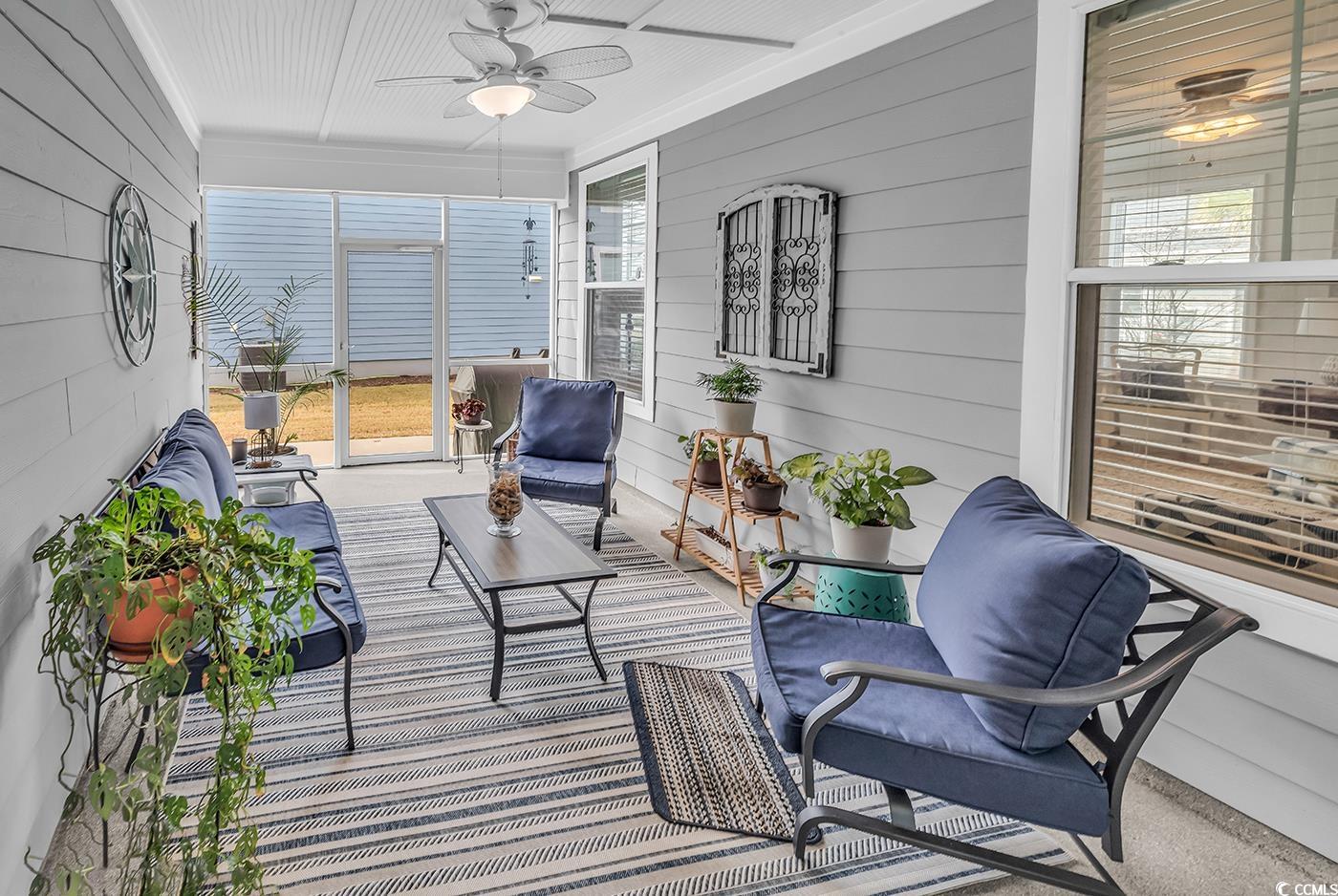 6024 Curran Street Murrells Inlet, SC 29576 - Photo 12 of 34 Sunroom / solarium with a ceiling fan and outdoor lounge area